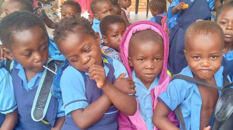 4 Malawian children in school uniforms at the Reach the Dream Foundation.