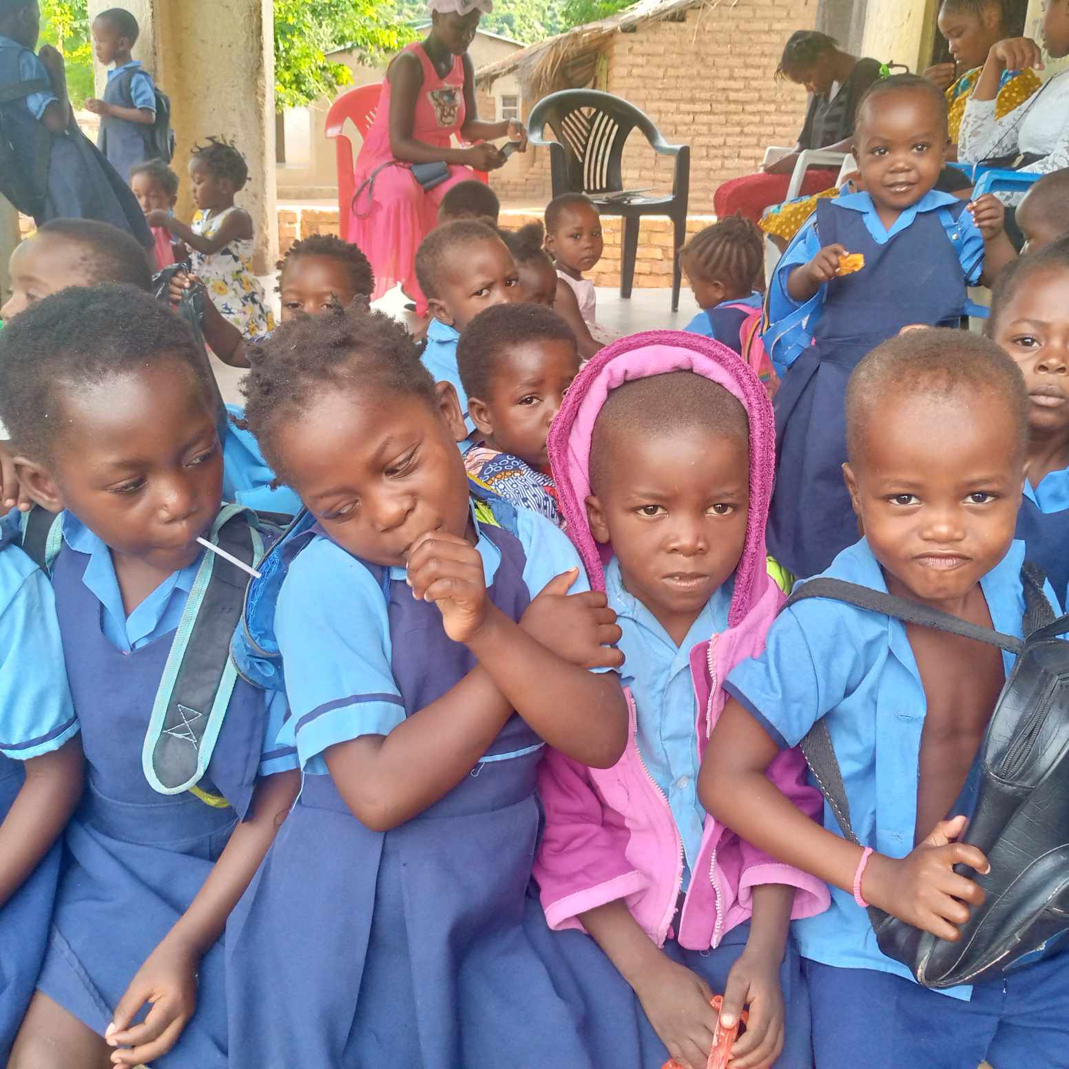 4 Malawian children in school uniforms at the Reach the Dream Foundation.